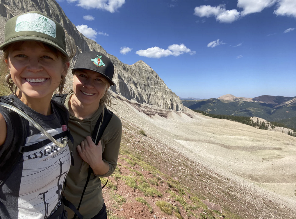 the founders of Farm To Summit on a mountain